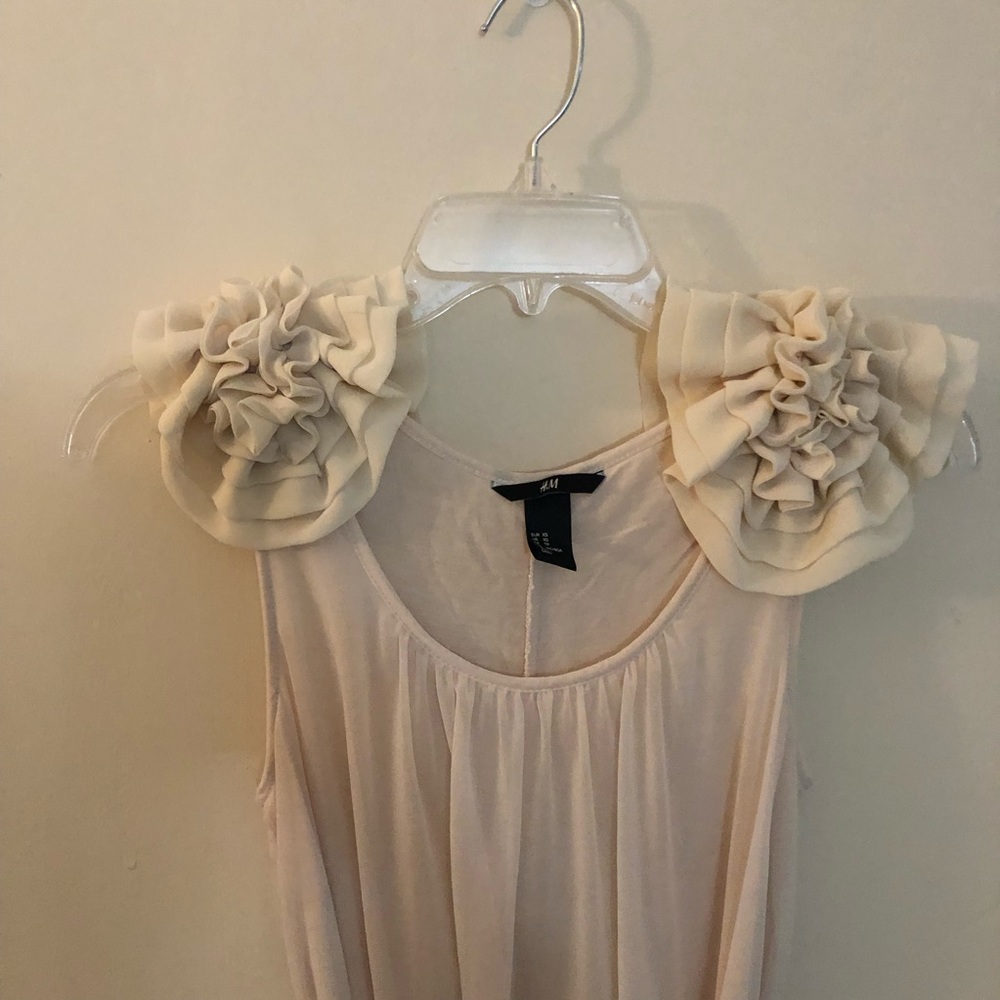 Floor length dress with floral shoulder detail